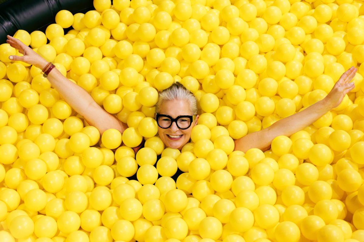 woman-in-glasses-in-yellow-ball-pool_4460x4460